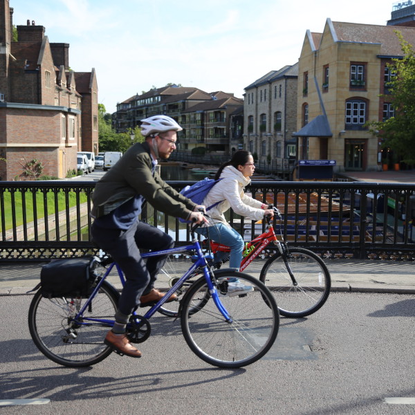 Two people cycling